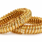 Ornate gold bangles featuring Polki-style stones and traditional detailing by SHA Jewelers