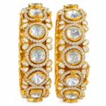 Traditional gold Polki bangles with floral stone settings by SHA Jewelers