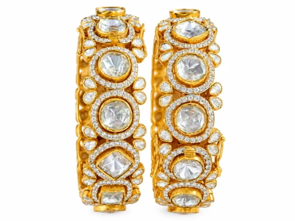 Traditional gold Polki bangles with floral stone settings by SHA Jewelers