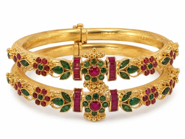Traditional gold bangles with ruby-red and emerald-green stones by SHA Jewelers